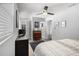 Well-lit bedroom featuring neutral walls, ceiling fan, and hardwood flooring at 3245 Freemont S Ter, St Petersburg, FL 33712