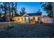Inviting home exterior featuring manicured landscaping, accent lighting, and a stylish blue door at 3245 Freemont S Ter, St Petersburg, FL 33712