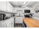 Updated kitchen with white cabinets, stainless steel appliances, and modern countertops at 3245 Freemont S Ter, St Petersburg, FL 33712