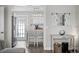 Open-concept kitchen featuring white cabinets, stainless appliances, and a breakfast bar at 3245 Freemont S Ter, St Petersburg, FL 33712