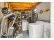 Functional laundry room with washer, dryer, storage shelving, and pegboard for organizing tools and accessories at 3245 Freemont S Ter, St Petersburg, FL 33712