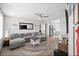 Bright living room featuring a plush sofa, stylish decor, ceiling fan, and light, neutral-toned walls at 3245 Freemont S Ter, St Petersburg, FL 33712