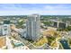 Breathtaking aerial view showing a tall condo, green spaces, and city views under a clear sky in a vibrant setting at 331 Cleveland St # 906, Clearwater, FL 33755