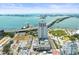 Panoramic aerial shot displaying a modern condo, waterfront access, and a swimming pool amenity on top of the building at 331 Cleveland St # 906, Clearwater, FL 33755