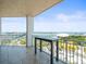 Balcony view showcasing beautiful waterfront views and outdoor table, perfect for relaxing at the modern condominium at 331 Cleveland St # 906, Clearwater, FL 33755