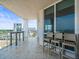 Relax on this tiled balcony, featuring stylish seating and views of the city skyline at 331 Cleveland St # 906, Clearwater, FL 33755
