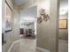 Elegant hallway leading to the dining room, showcasing stylish wall decor and a cohesive design at 331 Cleveland St # 906, Clearwater, FL 33755