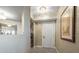 Inviting hallway with elegant textured wallpaper, framed art, and decorative lighting fixtures at 331 Cleveland St # 906, Clearwater, FL 33755