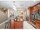The kitchen bar area looks into the dining room and features stainless steel appliances and modern pendant lights at 331 Cleveland St # 906, Clearwater, FL 33755