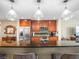 This kitchen is equipped with stainless steel appliances, dark countertops, and custom lighting at 331 Cleveland St # 906, Clearwater, FL 33755