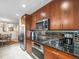 This kitchen features stainless steel appliances, granite countertops, and lots of cabinet space at 331 Cleveland St # 906, Clearwater, FL 33755