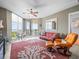 This living room features seating and a large sliding glass door to a patio that overlooks the beach at 331 Cleveland St # 906, Clearwater, FL 33755