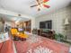 This living room has an open floor plan and connects to the kitchen with barstool seating at 331 Cleveland St # 906, Clearwater, FL 33755