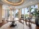 Welcoming lobby with a stylish chandelier, expansive windows, and scenic outdoor views at 331 Cleveland St # 906, Clearwater, FL 33755