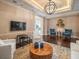 Elegant lounge area featuring modern furniture, a stylish chandelier, and wood floors, perfect for relaxing and entertaining at 331 Cleveland St # 906, Clearwater, FL 33755