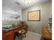 Functional office space with dark wood desk, printer, and neutral wall color at 331 Cleveland St # 906, Clearwater, FL 33755