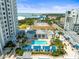 Luxurious rooftop pool area with lounge chairs and lush landscaping near the condominium at 331 Cleveland St # 906, Clearwater, FL 33755