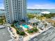 Modern rooftop pool area featuring lounge chairs and garden near the luxury high rise condominium building at 331 Cleveland St # 906, Clearwater, FL 33755