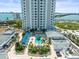 Rooftop oasis featuring a pool, lounge area, and lush landscaping offering a serene escape at the condominium at 331 Cleveland St # 906, Clearwater, FL 33755
