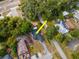 Bird's eye view of the house and neighborhood, highlighting the layout and landscaping at 351 Hancock St, Dunedin, FL 34698
