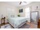 Bright bedroom boasts a comfortable bed and hardwood flooring, creating a cozy and inviting space at 351 Hancock St, Dunedin, FL 34698