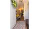 Inviting entryway featuring hardwood floors, a bench, and a decorative wreath on the front door at 351 Hancock St, Dunedin, FL 34698