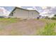 The side of a single Gathering home, showcasing well-maintained green space at 37642 Landis Ave, Zephyrhills, FL 33541