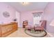Inviting bedroom with traditional decor, complemented by natural light and warm wood furniture at 37642 Landis Ave, Zephyrhills, FL 33541