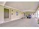 A spacious carport featuring ample parking, smooth flooring, and easy access at 37642 Landis Ave, Zephyrhills, FL 33541