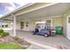 A spacious carport featuring ample parking and a golf cart at 37642 Landis Ave, Zephyrhills, FL 33541