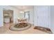 Dining room with table and chairs near the front door and a peek into the kitchen at 37642 Landis Ave, Zephyrhills, FL 33541