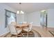 Dining area featuring hardwood floors and stylish furnishings at 37642 Landis Ave, Zephyrhills, FL 33541