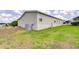 View of home featuring vinyl siding and manicured lawn on a sunny day at 37642 Landis Ave, Zephyrhills, FL 33541