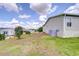 Home's exterior shows the vinyl siding, landscaping, and a sunny view at 37642 Landis Ave, Zephyrhills, FL 33541