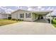Well-maintained home with covered parking, offering comfort and convenience in a quiet community at 37642 Landis Ave, Zephyrhills, FL 33541