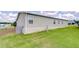 Exterior view of home with vinyl siding and well-maintained lawn at 37642 Landis Ave, Zephyrhills, FL 33541