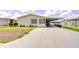 Charming single Gathering home with a spacious carport and well-maintained landscaping at 37642 Landis Ave, Zephyrhills, FL 33541