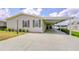 Charming single Gathering home with a spacious carport and well-maintained landscaping at 37642 Landis Ave, Zephyrhills, FL 33541