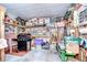 Spacious garage for storage and hobbies, equipped with shelves, tools, and ample workspace at 37642 Landis Ave, Zephyrhills, FL 33541