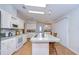 Bright kitchen with a large island, white cabinets, and modern appliances at 37642 Landis Ave, Zephyrhills, FL 33541