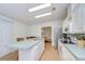 Open kitchen with a kitchen island, breakfast bar, stainless appliances at 37642 Landis Ave, Zephyrhills, FL 33541