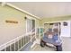 Covered patio with golf cart, offering convenient parking and outdoor space at 37642 Landis Ave, Zephyrhills, FL 33541