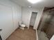 This is a view of the bathroom with a shower-tub combo and a toilet at 37913 Wicklow Ave, Zephyrhills, FL 33541