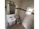 Tiled bathroom features a vanity, medicine cabinet, and a window at 37913 Wicklow Ave, Zephyrhills, FL 33541