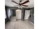 Bedroom showcasing a closet with sliding mirrored doors, neutral paint, and a ceiling fan at 37913 Wicklow Ave, Zephyrhills, FL 33541
