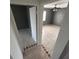 Bedroom showcasing neutral paint, tile floors, a ceiling fan and natural light at 37913 Wicklow Ave, Zephyrhills, FL 33541