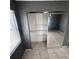 Bedroom closet with sliding mirrored doors and wire shelving for organization at 37913 Wicklow Ave, Zephyrhills, FL 33541