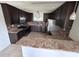 Beautiful kitchen features granite countertops, stainless steel appliances, and dark wood cabinetry at 37913 Wicklow Ave, Zephyrhills, FL 33541