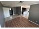 Bright living area with tile flooring leading to the kitchen and hallway at 37913 Wicklow Ave, Zephyrhills, FL 33541