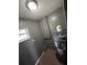 This is a shot of the utility room with a water heater and a small window at 37913 Wicklow Ave, Zephyrhills, FL 33541